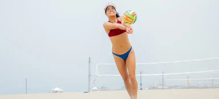 Playing beach volleyball is a fairly satisfying activity